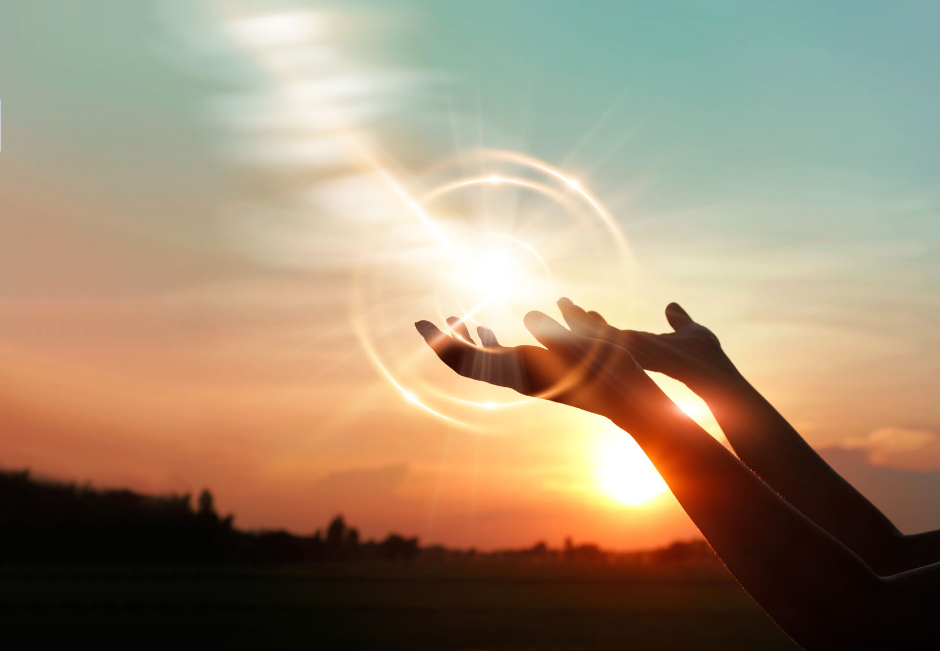 Hands holding sunlight. Spiritual concept